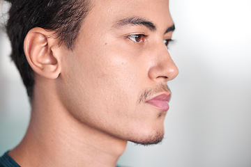 Image showing Face, thinking and focus with a sports man in a gym, looking serious during his workout for health. Idea, serious and mindset with a handsome young male athlete training in a lifestyle center