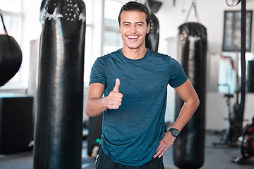 Image showing Laughing, thumbs up and portrait of man in gym for success, motivation or workout. Comic, hand gesture or happy male athlete with emoji for yes, like or approval, agreement or fitness, goal or target