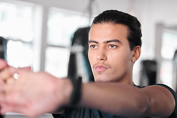 Image showing Hands, stretching fingers and man in gym ready to start workout, training or exercise. Sports fitness, thinking and serious male athlete warm up, stretch or prepare for exercising for flexibility.