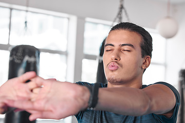 Image showing Hands, stretching fingers and man in gym ready to start workout, training or exercise. Sports fitness, health and serious male athlete warm up, stretch or prepare for exercising for flexibility.