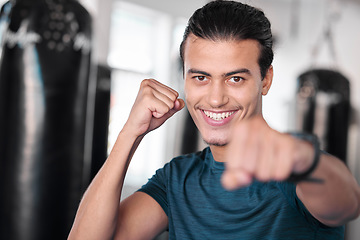 Image showing Portrait, boxer punch and smile of man in gym ready to start workout, training or exercise. Boxing sports, wellness face and happy male athlete throw fist for fight, exercising or mma for strength.