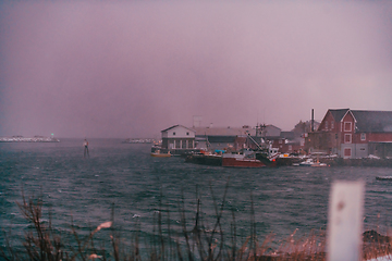 Image showing Traditional Norwegian fisherman's cabins and boats