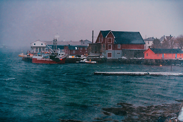 Image showing Traditional Norwegian fisherman's cabins and boats