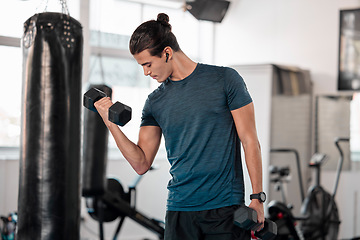 Image showing Exercise, dumbbell and man with earphones in gym for streaming music while exercising. Sports workout, fitness and bodybuilder listen to podcast or radio while lifting weights for strength training.