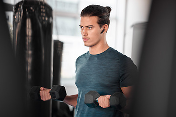 Image showing Workout, dumbbells and man with earphones in gym for streaming music while exercising. Sports, fitness and serious bodybuilder listening to podcast or radio while lifting weights for muscle exercise.