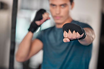 Image showing Man, hands and fists for boxing fitness, fight or strength training exercise, workout or martial arts at gym. Fist of male boxer or fighter ready for fighting challenge, practice or punching indoors