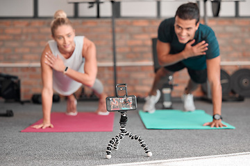 Image showing Live streaming, phone fitness and people in exercise teamwork, workout and social media video on tripod. Happy athlete training, influencer couple of friends or sports content creation on smartphone