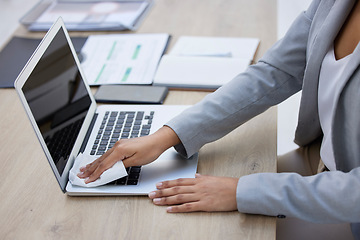 Image showing Hands, laptop or cleaning cloth for hygiene, wellness or bacteria protection in modern corporate office. Business woman, technology or wiping dust for health maintenance, safety or virus disinfection