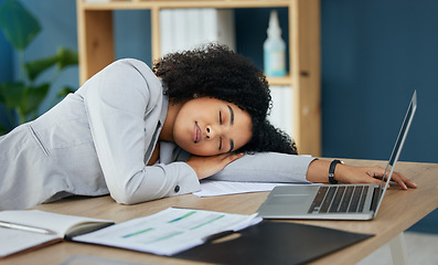Image showing Business woman, tired or sleeping on desk in financial accounting office in overworked, mental health nap or burnout crisis. Sleep, fatigue or exhausted corporate worker on table with finance laptop
