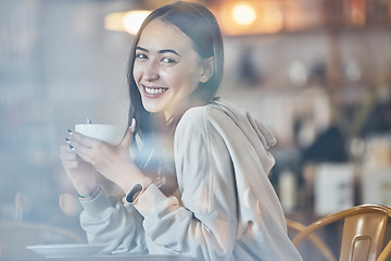 Image showing Happy, cafe and portrait of a woman with a coffee, enjoying a drink and warm beverage. Smile, relax and a girl drinking a cappuccino, tea or latte at a restaurant in the morning for happiness