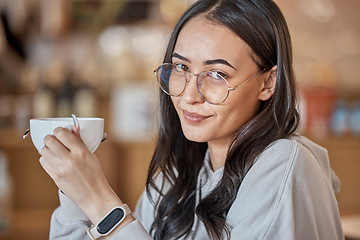 Image showing Coffee, portrait smile and woman at cafe with delicious caffeine, espresso or cappuccino. Face glasses, tea and happy female relax while holding cup, drink or mug with beverage at shop or restaurant.