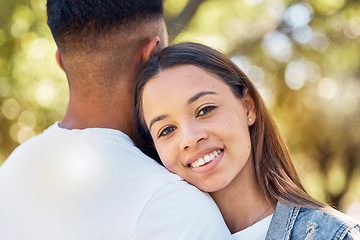 Image showing Love, hug and shoulder with couple in park for bonding, affectionate and free time. Happiness, date and smile with portrait of woman hugging man in nature for relax, summer and romance on vacation