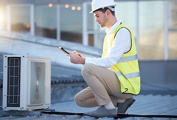 Image showing Man, engineer and tablet on roof for air conditioning maintenance, tech and digital analysis. Technician, mobile touchscreen and rooftop for ac repair for building, industry and development in city