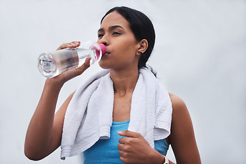 Image showing Running, rest and drinking water with woman in outdoors for fitness, training and cardio endurance. Stamina, health and workout with tired female runner for jogging, exercise and performance