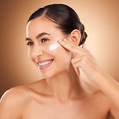 Image showing Skincare, lotion and woman face cleaning of a young person smile with cream in a studio. Happy, glow and dermatology beauty treatment of a female with cosmetics, spa and cosmetology luxury facial