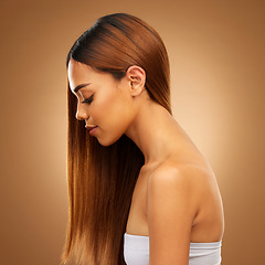 Image showing Hair care, beauty and profile in studio of woman for growth and color shine or healthy texture. Aesthetic female face for haircare, natural makeup and hairdresser or salon style on brown background