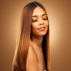 Image showing Beauty, hair care and face of woman in studio for growth and color shine or healthy texture. Aesthetic female model for haircare, natural makeup glow and hairdresser or salon on a brown background