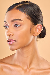 Image showing Beauty, face and skin care of woman in studio for glow, cosmetics, dermatology or makeup. Aesthetic female .profile for self love, natural facial glow and skincare shine results on a brown background