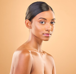 Image showing Beauty, face and portrait of woman in studio for skincare, cosmetics, dermatology or makeup. Aesthetic female .serious about self care, natural skin and spa facial shine results on a brown background