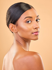 Image showing Beauty, portrait and face of woman in studio for skincare, cosmetics, dermatology or makeup. Aesthetic female skin for self care, natural glow and spa facial shine results on a brown background