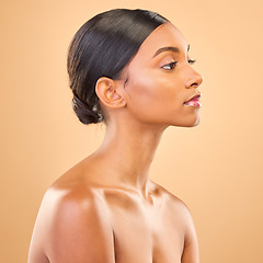 Image showing Beauty, face and profile of woman in studio for skincare, cosmetics, dermatology or makeup. Aesthetic female .serious about self care, natural skin and spa facial shine results on a brown background