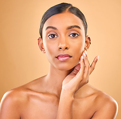 Image showing Skincare, face portrait and beauty of woman in studio isolated on brown background. Natural makeup, cosmetics and confident Indian female model with spa facial treatment for healthy or flawless skin.