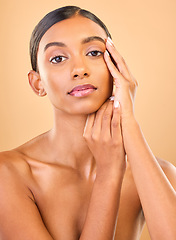 Image showing Skincare, face portrait and beauty of woman in studio isolated on a brown background. Makeup, cosmetics and confident Indian female model with spa facial treatment for healthy, glow or flawless skin.