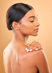 Image showing Beauty, face and skin of woman in studio for skincare, cosmetic, dermatology or makeup. Aesthetic female .profile and hand for self care, natural glow and facial shine or bodycare on brown background