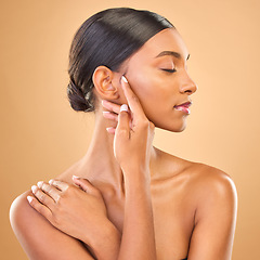 Image showing Beauty, face profile and skin of woman in studio for skincare, cosmetics, dermatology or makeup. Aesthetic female model .hands for natural self care and spa facial shine results on a brown background