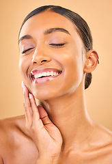 Image showing Makeup, beauty and face or smile of woman in studio for skincare, cosmetics and dermatology. Aesthetic female .hand for self care, natural skin and spa facial shine results on a brown background