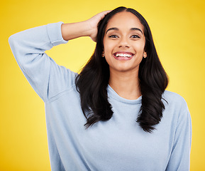 Image showing Young woman, hair and beauty, happy in portrait and satisfaction with gen z, fashion on yellow studio background. Happiness, youth and Indian female smile, haircare and cosmetics, growth and shine