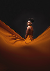 Image showing Black woman, art and fashion, fabric on dark background with mockup and aesthetic movement. Flowing silk, fantasy and artistic portrait of serious African model in creative designer dress in studio.