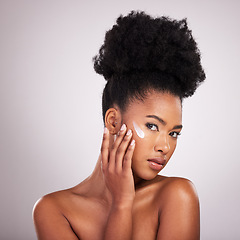 Image showing Black woman, face and moisturizer cream for skincare beauty or cosmetics against a gray studio background. Portrait of African American female applying moisturizing creme, lotion or facial product