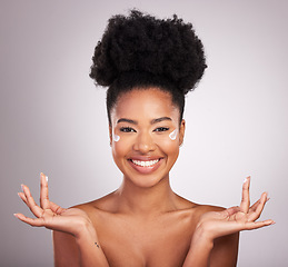 Image showing Black woman, moisturizer cream and smile for skincare beauty or cosmetics against a gray studio background. Portrait of happy African female smiling with moisturizing creme, lotion or facial product