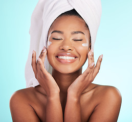 Image showing Skincare, beauty and lotion, black woman with smile on face for anti aging or skin glow on blue background. Cosmetics, facial and cream, African model with moisturizer or cleansing product in studio.