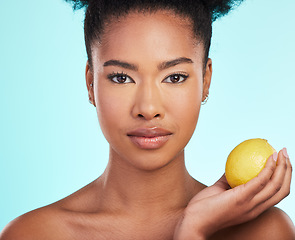 Image showing Lemon, skincare and portrait of serious black woman in studio for wellness, natural cosmetics and facial. Dermatology spa, beauty and face of girl with citrus fruit for detox, vitamin c and nutrition