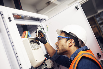 Image showing Man, phone and technician in electric inspection for power or sustainable energy at work site. Male electrician, contractor or engineer with smartphone looking to inspect electricity on circuit board