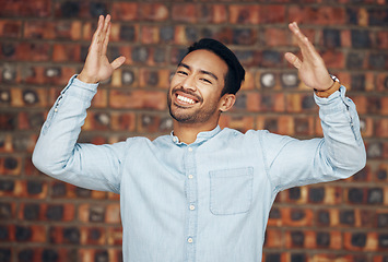 Image showing Happy, excited and portrait of asian man and brick wall background for confidence, trendy and natural. Pride, cool and style with male and arms up for laughing, happiness and goofy expression