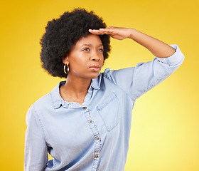 Image showing Black woman, hand and studio for distance, future and looking ahead for life by yellow background. Student, african and girl with vision, goal and ambition for career, study and focus with thinking