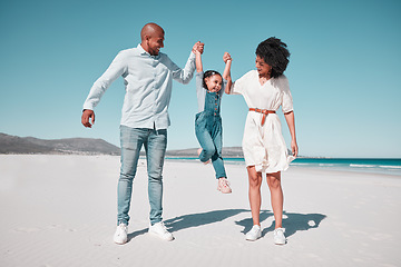 Image showing Father, mother and daughter with swing at beach, holding hands and support for funny game with smile. Happy family, ocean and vacation with man, woman and girl for freedom, sunshine or bond with love