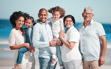 Image showing Big family, smile and portrait at beach on vacation, bonding and care at seashore. Holiday relax, summer ocean and happy father, mother and grandparents, girls or kids enjoying quality time together.