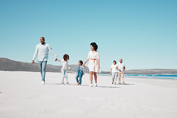 Image showing Mother, father and children walking on beach with grandparents on summer holiday, vacation and weekend. Happy family, travel and mom, dad and kids holding hands for fun, bonding and quality time