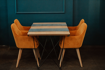 Image showing Modern cafe furniture. Modern table and chairs for the cafeteria