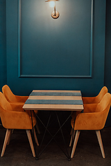 Image showing Modern cafe furniture. Modern table and chairs for the cafeteria