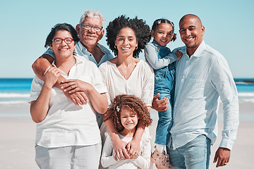 Image showing Smile, big family and portrait at beach on vacation, bonding and care at seashore. Holiday relax, summer ocean and happy father, mother and children, girl or grandparents enjoying time together.