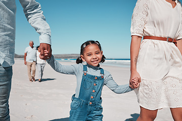 Image showing Mother, father and girl holding hands by the beach to relax on summer holiday, vacation and weekend. Happy family, travel and portrait of child with mom and dad for fun, bonding and quality time