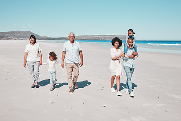 Image showing Beach, grandparents and children walking with parents to relax on summer holiday, vacation and weekend. Happy family, travel and mother, dad and kids holding hands for fun, bonding and quality time