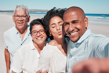 Image showing Family, smile and selfie portrait at beach on vacation, bonding and care at seashore. Holiday kiss, summer ocean and couple relax with grandparents taking pictures for social media and happy memory.