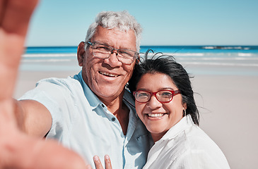 Image showing Portrait, selfie and elderly couple at a beach for travel, vacation and bonding against ocean background. Face, love and seniors enjoying retirement, holiday and sea trip, photo and profile picture