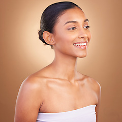 Image showing Beauty, skincare and face of Indian woman with smile for wellness, glowing skin and spa treatment. Luxury salon, dermatology and happy girl in studio with cosmetics, natural makeup and confidence